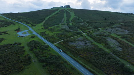 aerial view of a mountainous landscape with road and wildlife