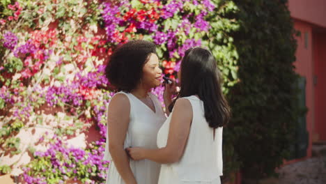 happy bride applying make up on her soulmate before wedding ceremony