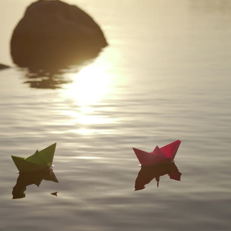 homemade origami boats at sunset. two paper ships floating in the river among stones in the evening. dreams and freedom concept.