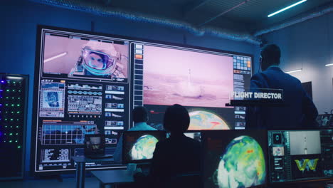 mission control team monitors rocket launch