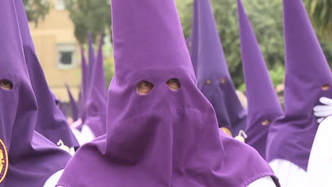 religious procession with holy week costumes and book