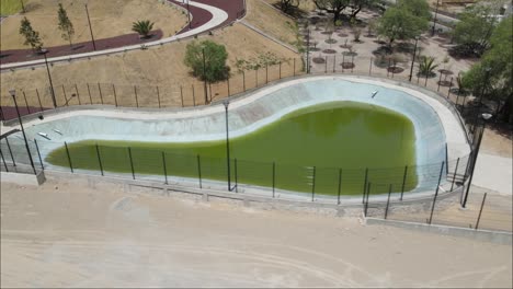 orbit-Drone-view-of-a-Construction-park-with-a-pond-in-the-center-in-Mexico