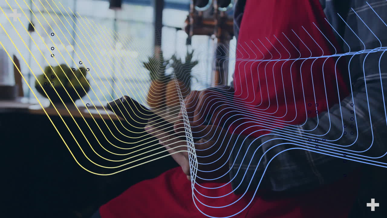 Animation of colorful wave patterns overlaying person sitting in modern cafe