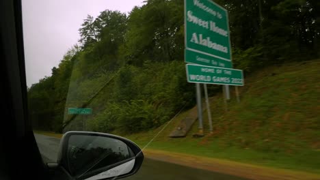 car passes the welcome sign to alabama