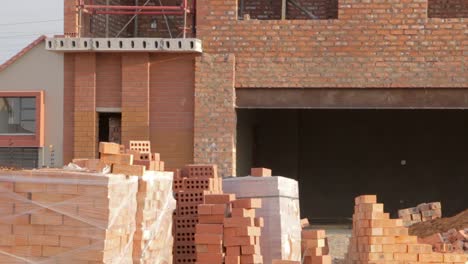 Tilt-of-new-house-Construction-site-outside-with-scaffolding