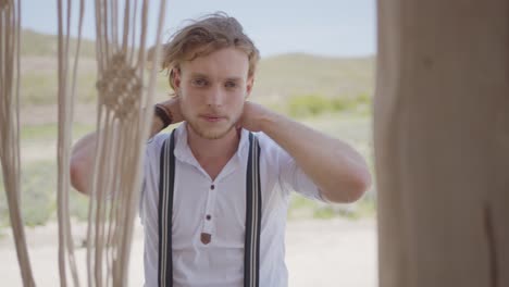 stylish man in boho-inspired outfit