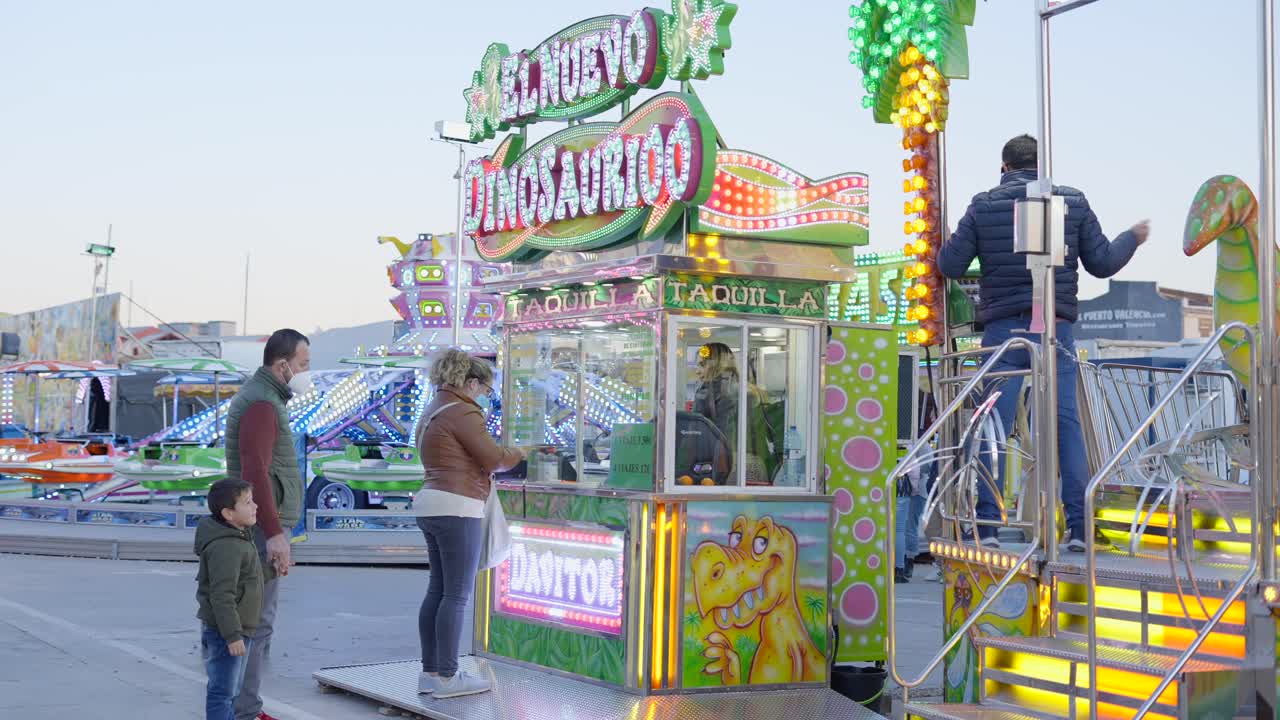 Family at a Fun Fair with Dinosaur Food Stall