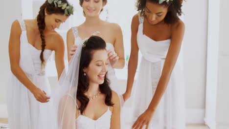 bridesmaid putting veil on the bride 4k 4k