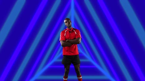 animation of african american male american football player with arms crossed over shapes