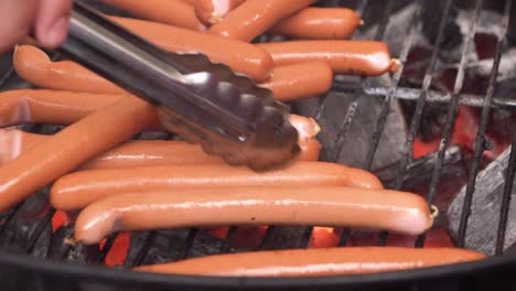 grilled hot dogs on a charcoal grill