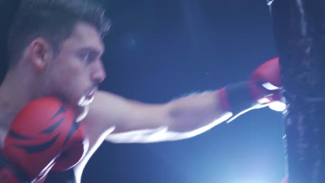 the fighter trains his fists in the boxing gym. boxing training.