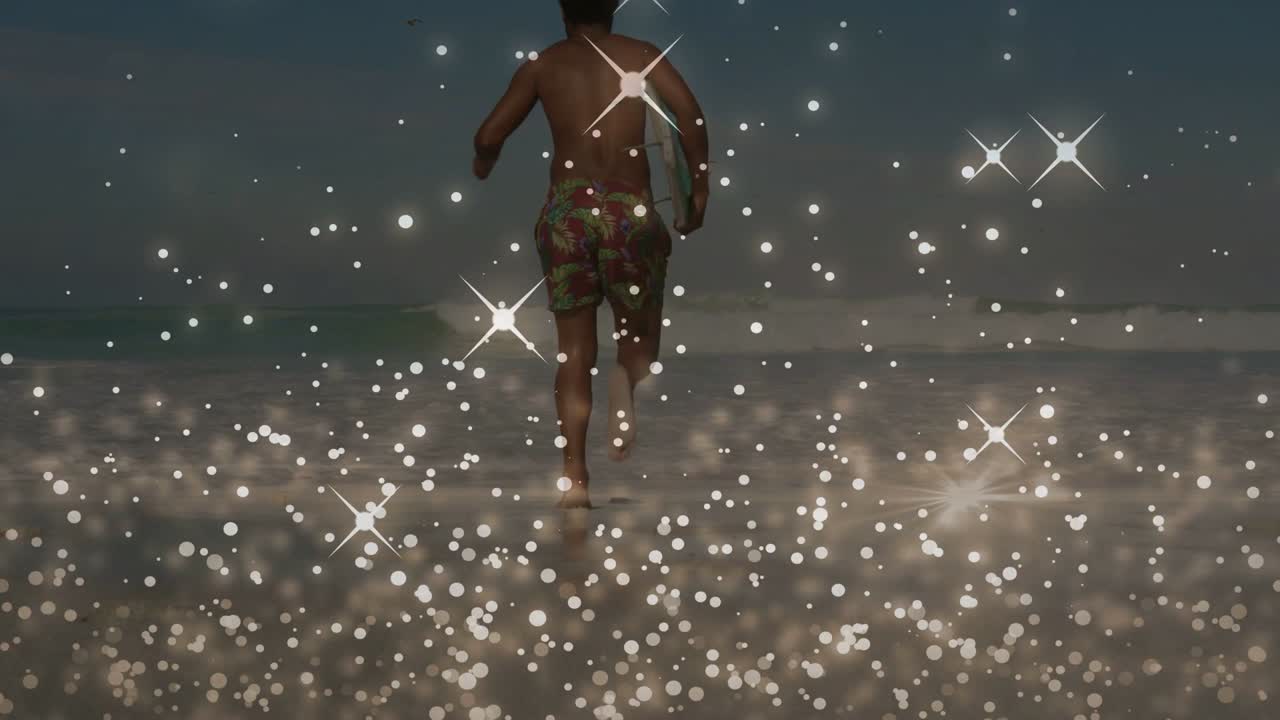Man leaving surf running to catch waves, holding bodyboard, bokeh overlaying foreground near man