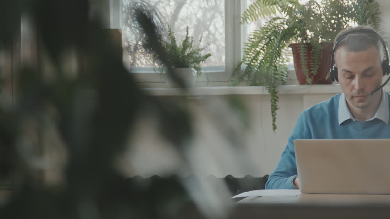 Man Talking to Customer at Call Center