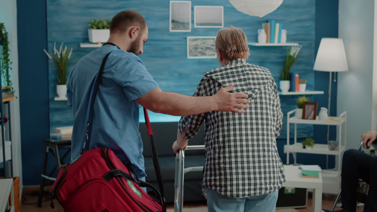 Man nurse supporting senior woman using walk frame