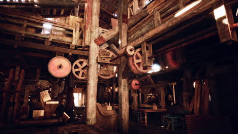 inside an old rustic barn with gears and machinery