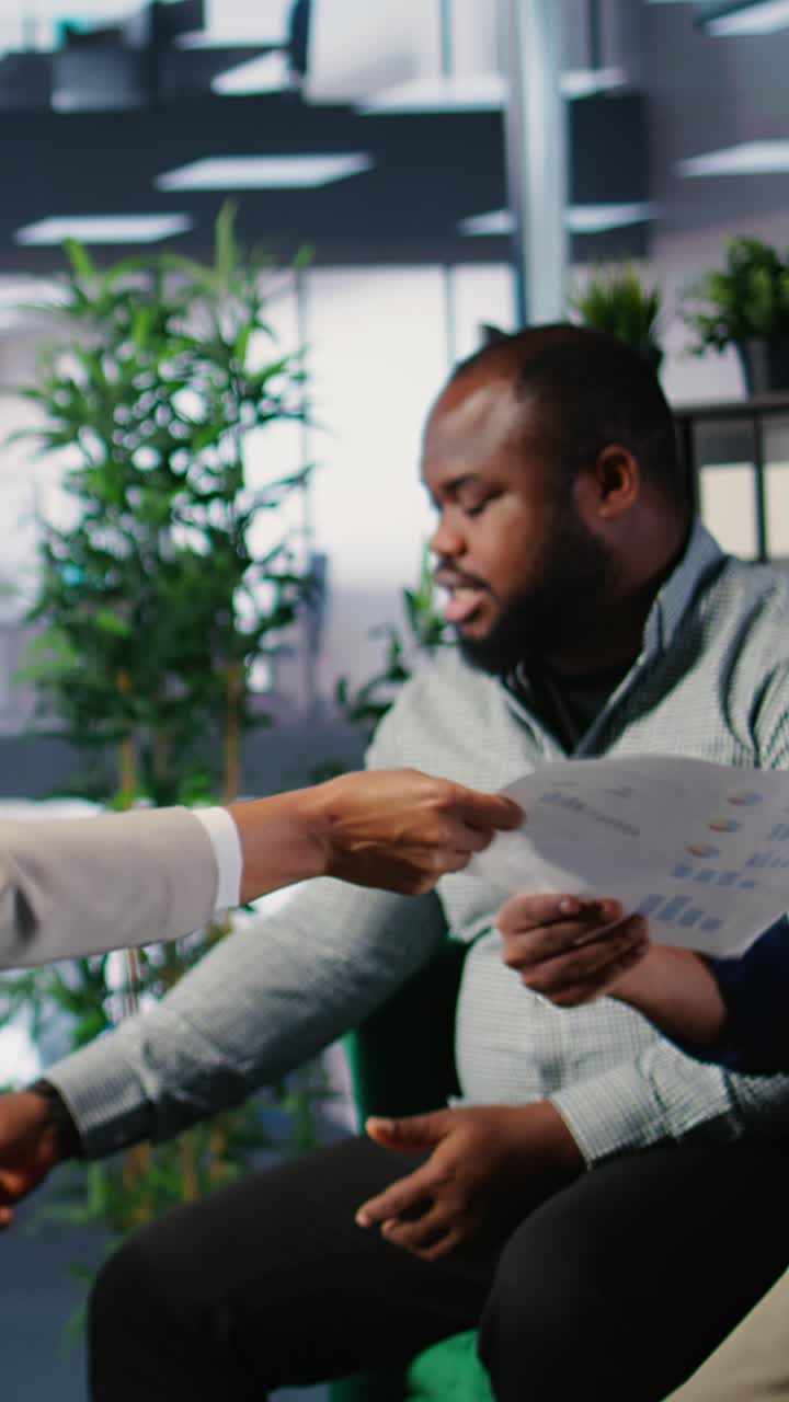 Vertical Video Multiethnic business team collaborating on company strategy