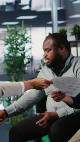 vertical video multiethnic business team collaborating on company strategy