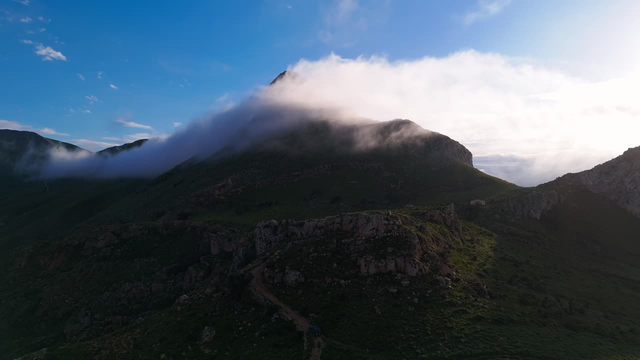 Monte monaco in san vito lo capo, sicily with misty clouds, aerial view