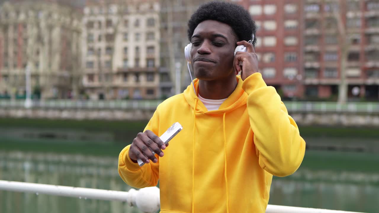 Man listening to music with headphones in the city