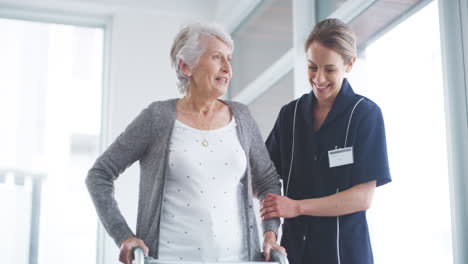 a-nurse-assisting-a-senior-woman-with-a-walker