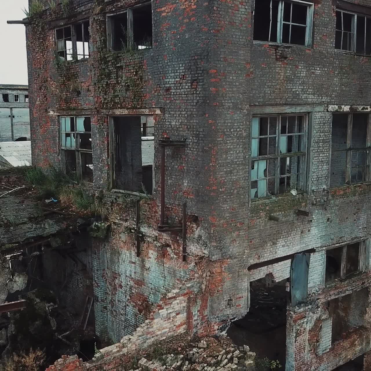 Ruins of an old factory. Old industrial building for demolition. Aerial view