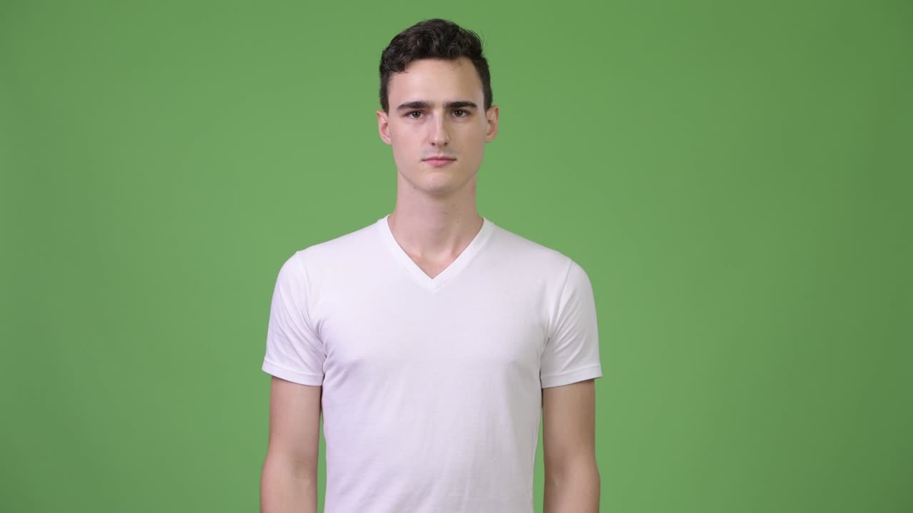 Young handsome man showing middle fingers