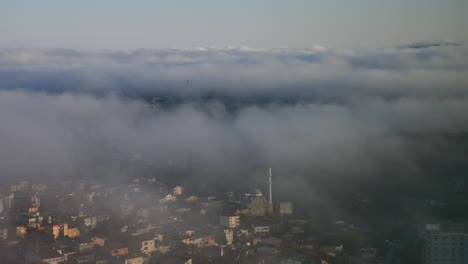 misty cityscape with mosque