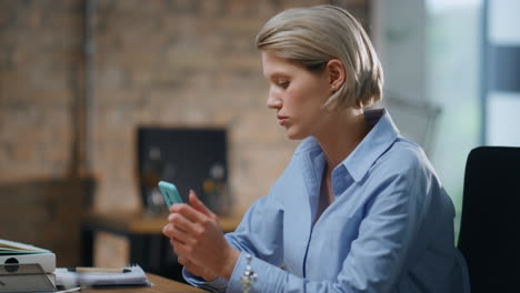 tired company worker waiting workday end sitting modern office coworking closeup