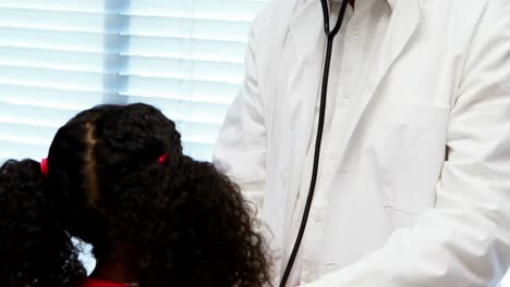 male doctor examining a patient