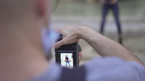 photographer taking a picture of a woman