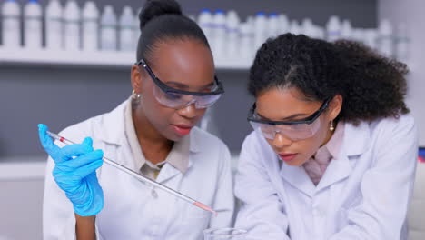 Scientist,-women-and-chemical-in-beaker