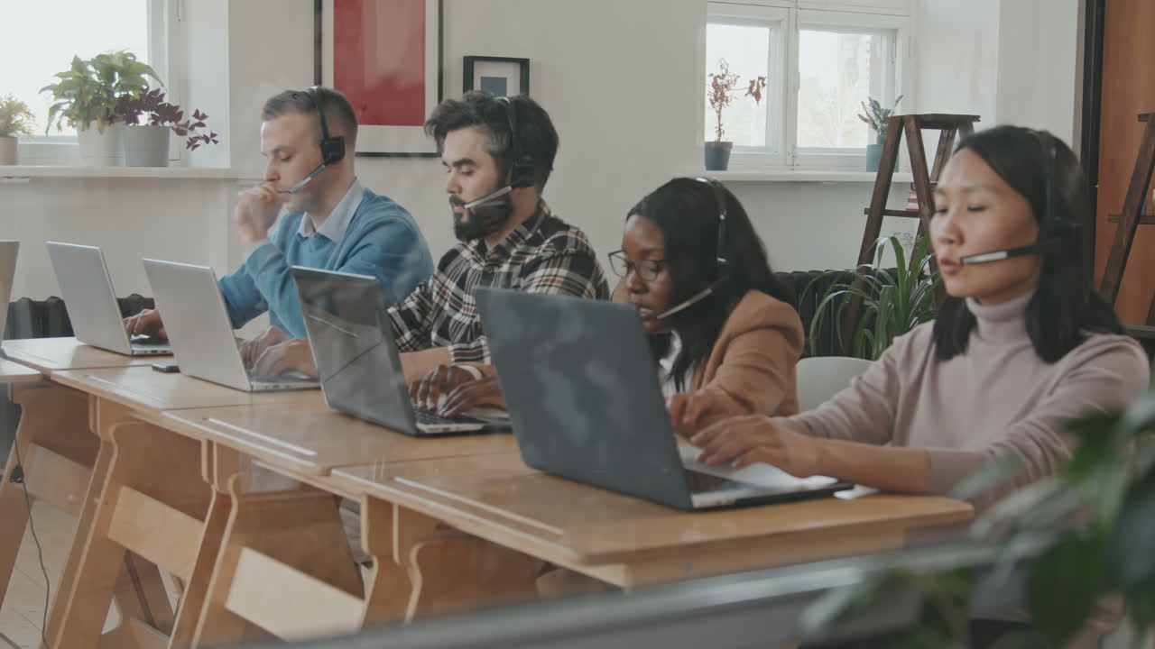 Call Center Workers Talking to Customers