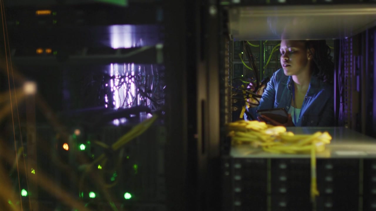 Woman technician starting handheld scan in rack aisle checking cables overlay rising verifying link