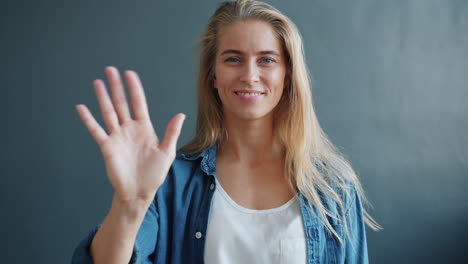 woman waving hello