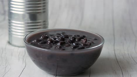 canned black beans in a glass bowl