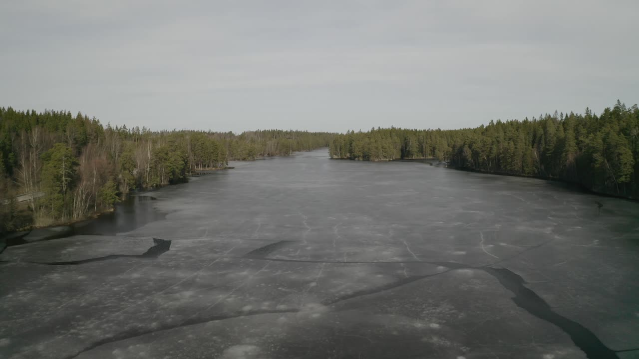 4k Aerial footage of water and woods.