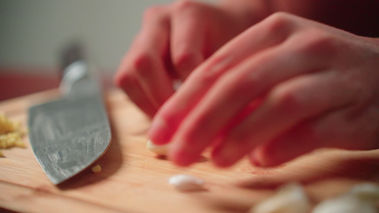 Peeling cloves of garlic by hand
