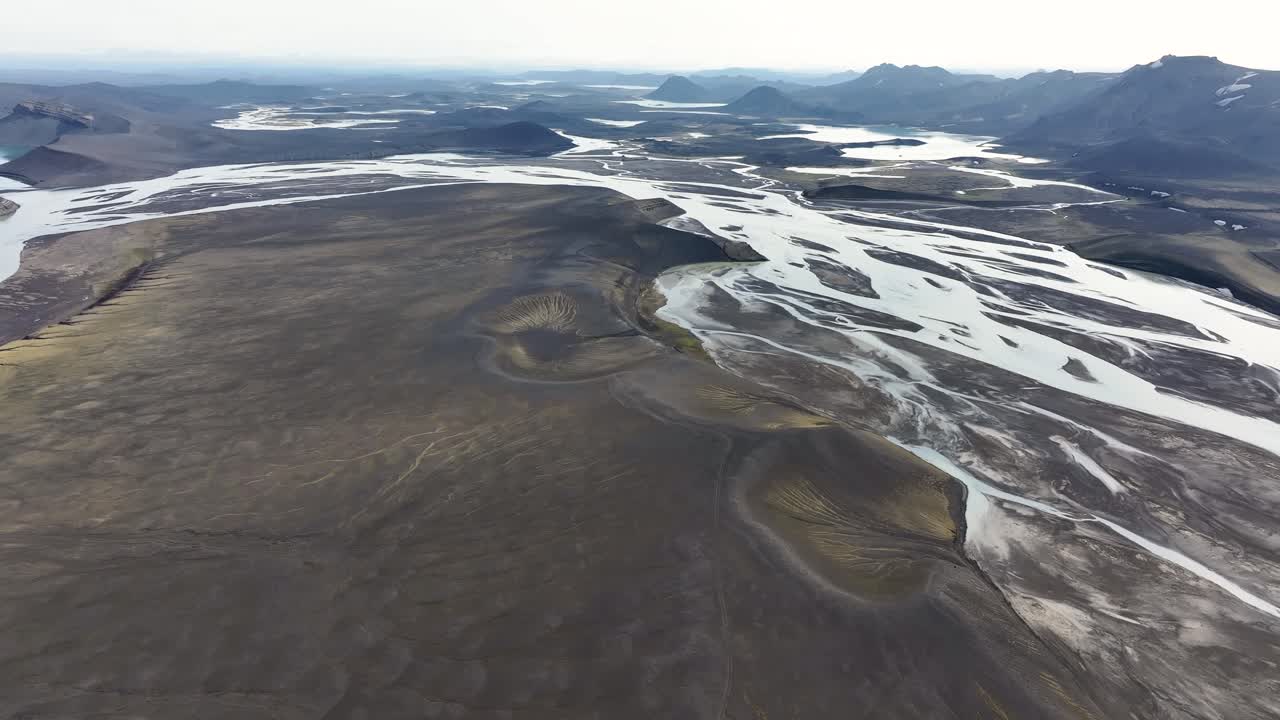 River delta and river bed on Iceland island during sunny day in highlands. Aerial forward wide shot