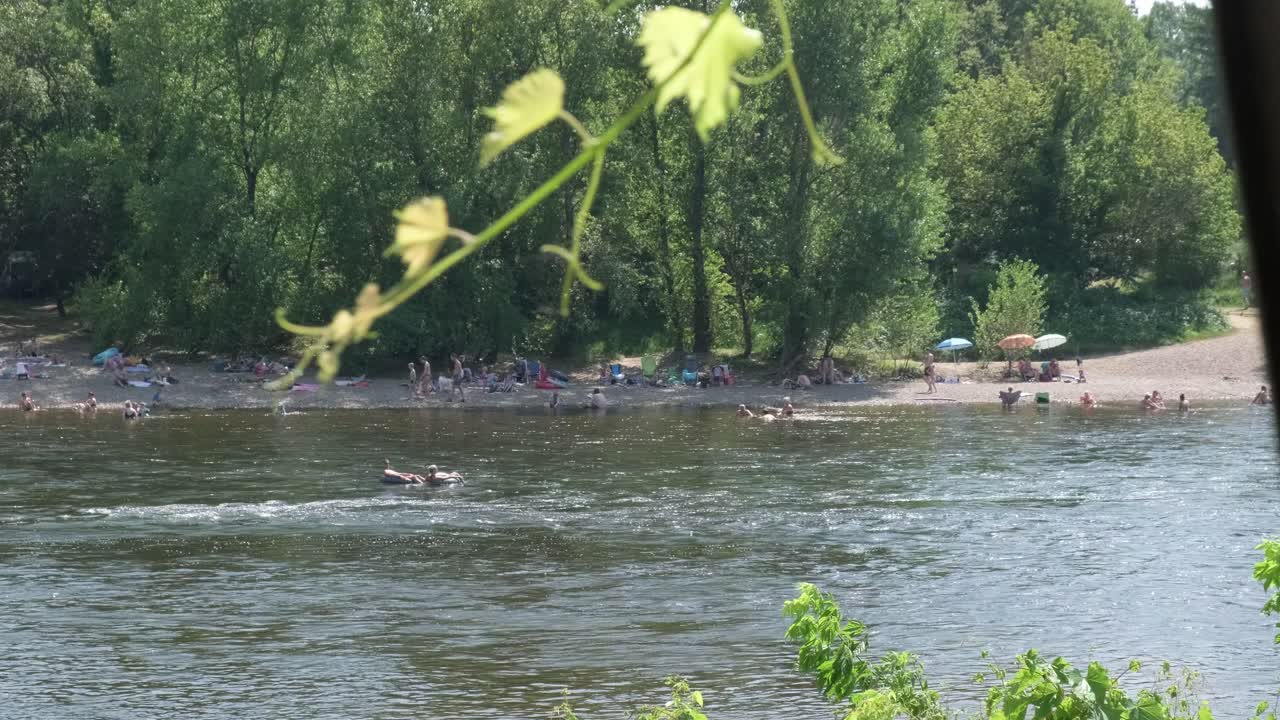 people enjoying the summer on a river in slow motion
