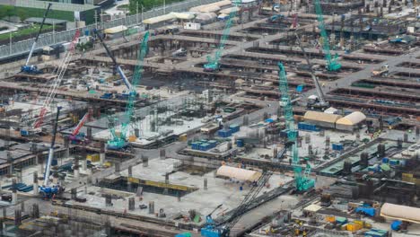 time lapse of construction site with heavy construction machinery in metropolis