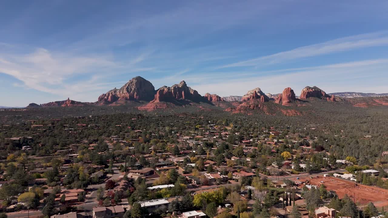 Discover Sedona's hidden canyons from a bird’s-eye perspective. This drone shot reveals the rugged, deep canyons framed by towering red rock cliffs