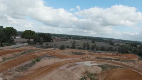 aerial forward view of a red clay motocross track