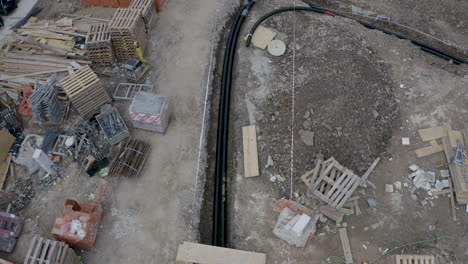 pipeline cables laid down in an excavated ditch at a construction site