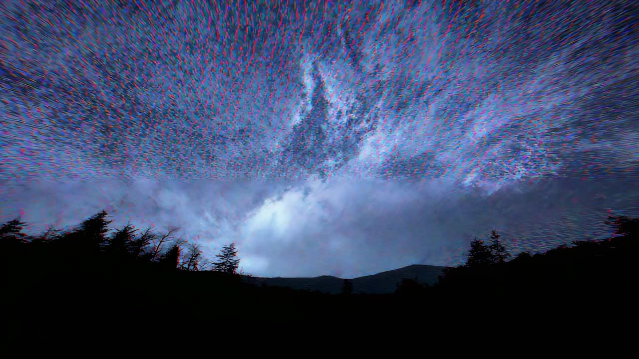 Faint green glow appearing in night sky over forest clearing shifting to purple red with clouds