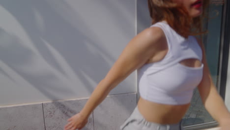woman in a crop top, outdoors