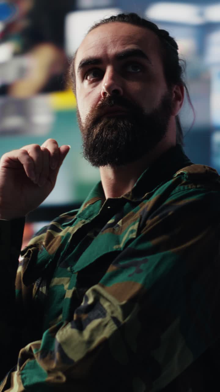 Vertical Video Military soldier satisfied with data collected from surveillance footage