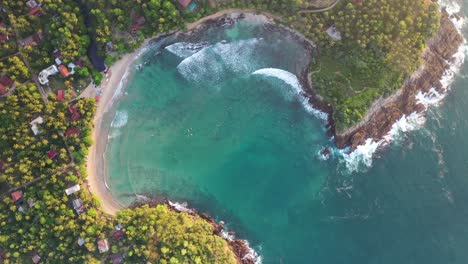 birds eye aerial view of exotic hiriketiya beach bay, sri lanka, tropical lagoon and coastline, top down drone shot