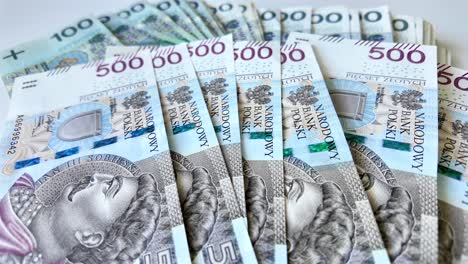 polish money counted on the table, highest denomination of pln 500