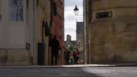 defocused shot of pedestrians and traffic on high street in oxford 02