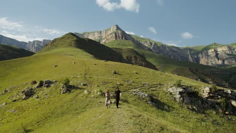 couple hiking in mountain valley